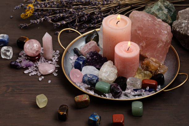 Healing chakra crystals therapy. Alternative rituals, gemstones for wellbeing, meditation, destress Healing reiki chakra crystals therapy. Rituals with gemstones and aromatherapy for wellbeing, meditation, destress, relaxation, mental health, spiritual practices. Energetical power concept crystal altar stock pictures, royalty-free photos & images