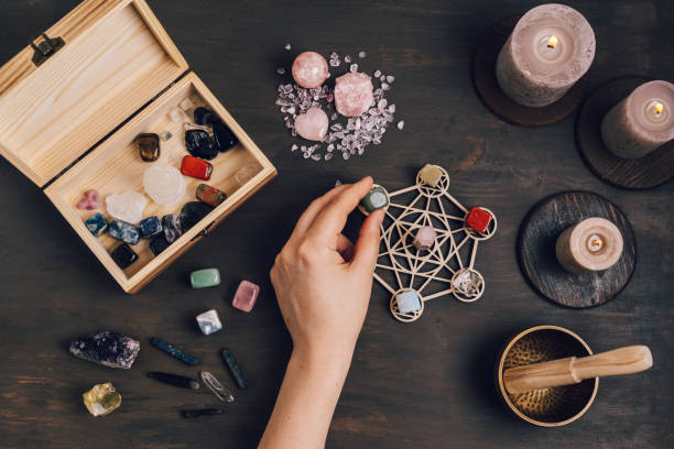 istock Healing chakra crystal grid therapy. Rituals with gemstones and aromatherapy for wellness, healing, meditation 1324566114