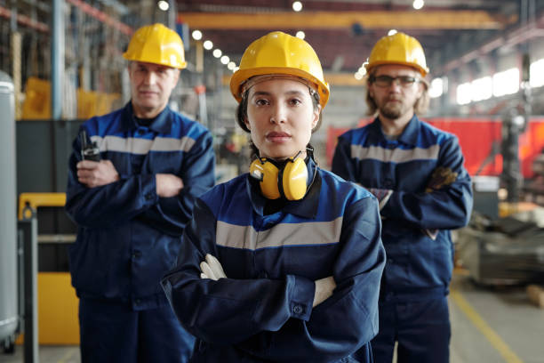 istock Young woman working at factory 1324567111