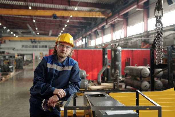 istock Bearded production worker leaning on metal frame 1324567148