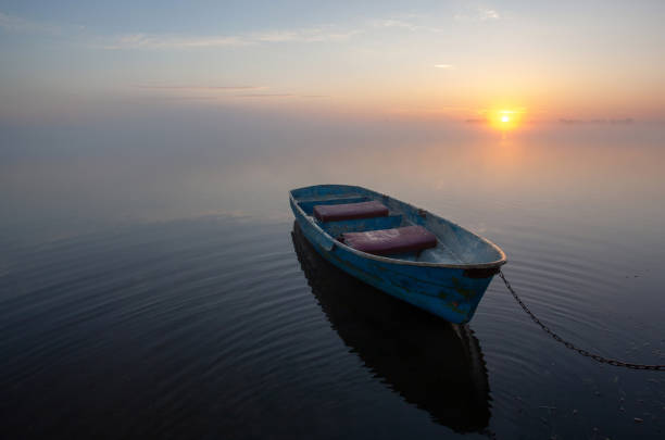 istock old wooden boat on the water 1324571593