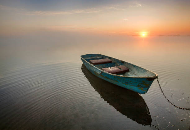 istock old wooden boat on the water 1324571600