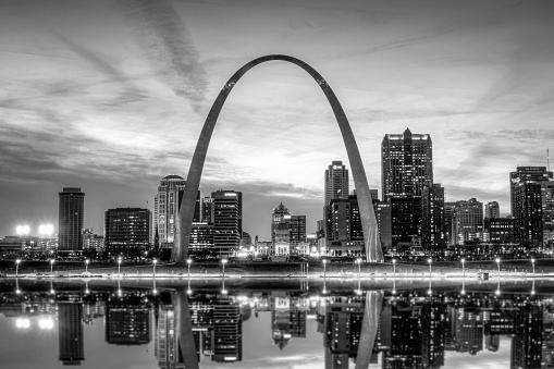 The St. Louis city skyline with Gateway Arch photographed at sunset.