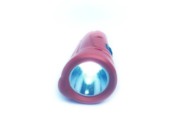 istock Small orange color 2 in 1 torch light isolated on white background 1324577240