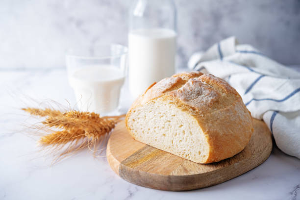 istock Wheat white bread with glasses of milk 1324578879
