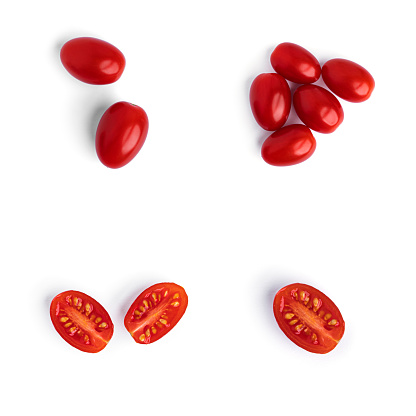 Fresh cherry tomatoes with water drops on a white background. High quality photo