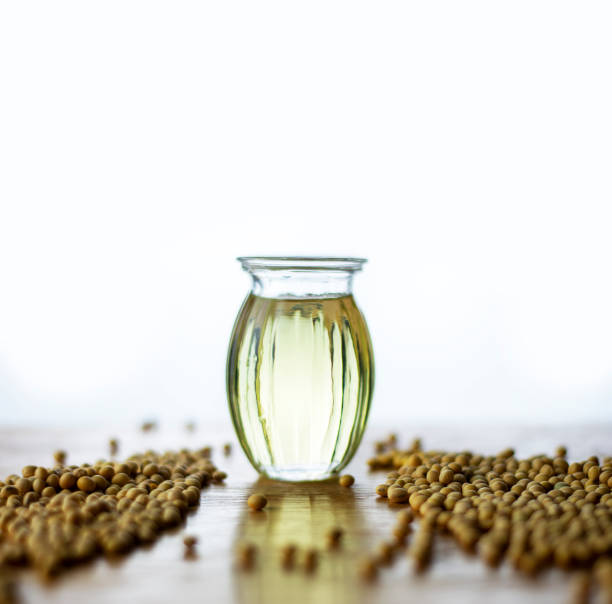 istock soy oil with soy beans on the table 1324583105