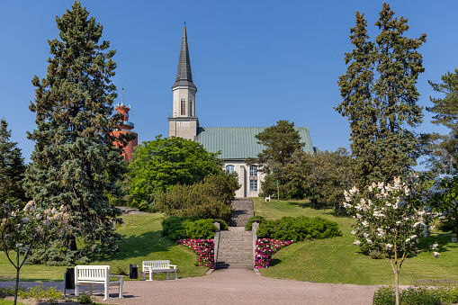Hanko, Finland - Jun 18th 2021: Hanko Church is surrounded by a beautiful public park.