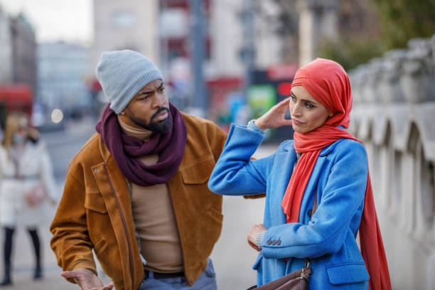 istock Young Multi-Ethnic Couple is Having a Relationship Problems During a Walking Through the City Streets. 1324595318