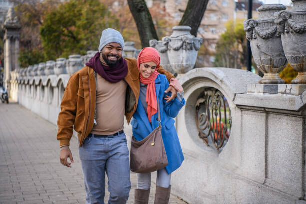 istock A Happy Multi-Ethnic Couple is Walking Through the Park. 1324595325