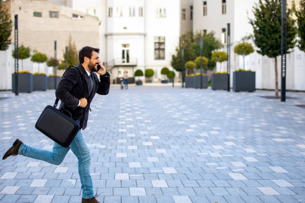 istock Young Businessman in Rush Hour. A Businessman is in Late for the Work. 1324598024