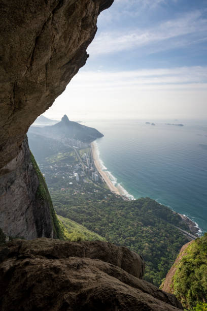 istock Beautiful mountani rainforest landscape seen from rocky cave 1324602232