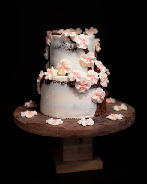 istock Cherry Blossom Wedding Cake on Walnut Cake Stand 1324602586