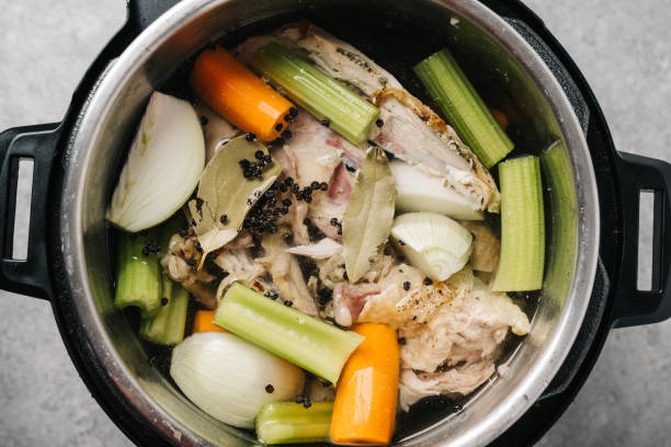 istock Bone broth ingredients in an Multi Cooker from overhead 1324603526
