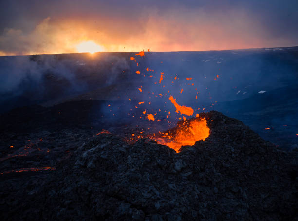 istock Volcanic terrain with burning hot lava 1324603550