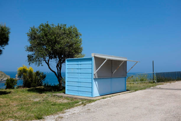closed icecream shop next to the sea in Platja de Garbet, CT, Spain