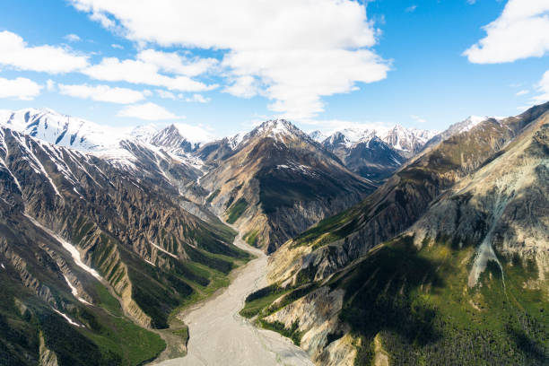 Mountainous Valley in Yukon Near Mount Logan Mountainous Valley in Yukon Near Mount Logan in Haines Junction, YT, Canada yt stock pictures, royalty-free photos & images