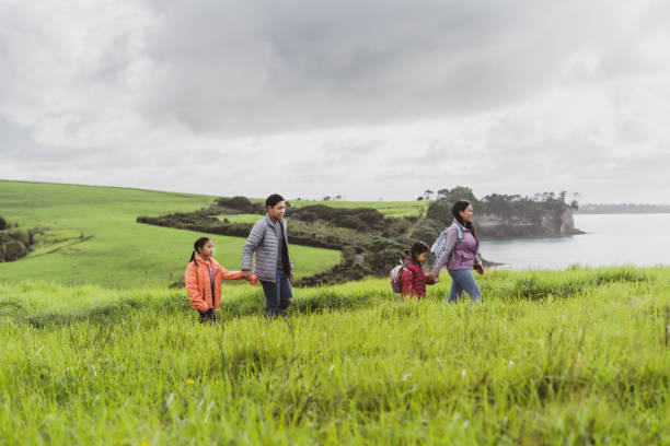 istock Family love hiking in meadows. 1324606437