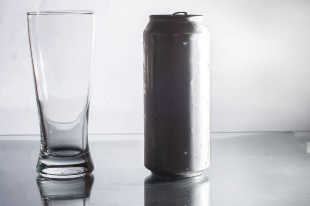 istock unlabeled beer can with a glass on the side and white background 1324607226