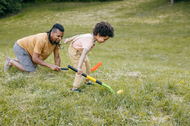 istock Dad spending summer days playing hockey with toddler son 1324609382