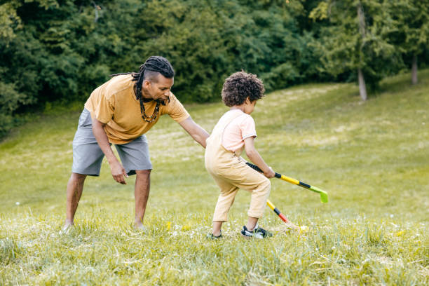 istock Dad spending summer days playing hockey with toddler son 1324609414