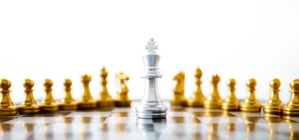 istock Concept of leadership. Silver king chess on the board. 1324611332