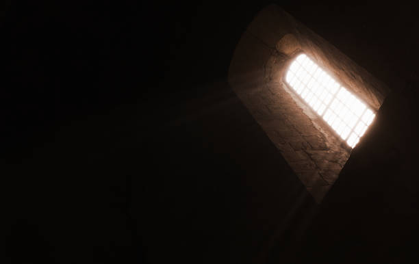 istock Dark church interior with glowing window, abstract 1324611390