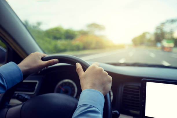 istock Driving car on city street 1324624662