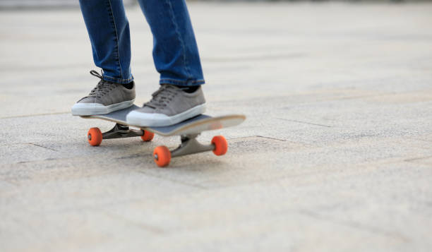 istock Skateboarder legs skateboarding at outdoors 1324627231