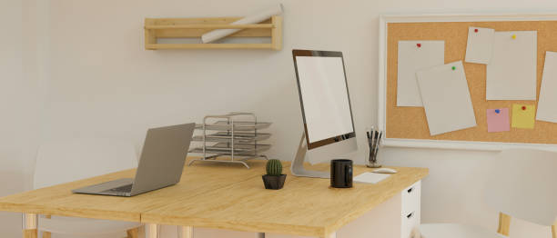 istock Desktop computer with mock-up screen on the wooden desk with stationery and camera in loft office room, 3D rendering 1324627298