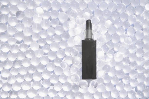 istock Serum bottle on bubble background. Spa health mechandise. Transparent texture 1324634193