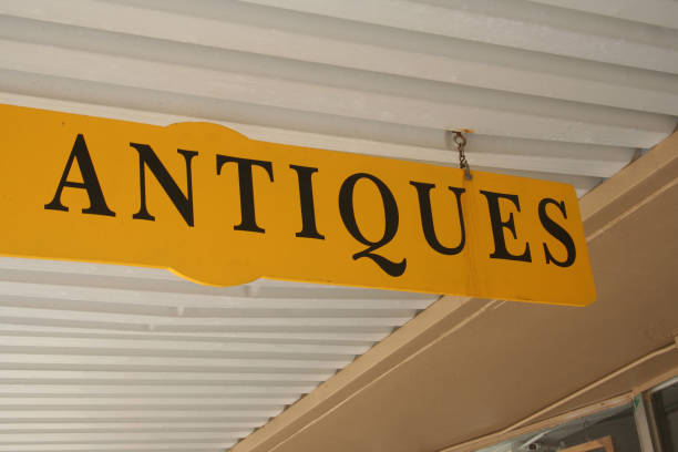 istock Yellow Antiques Sign on building front entrance 1324634363