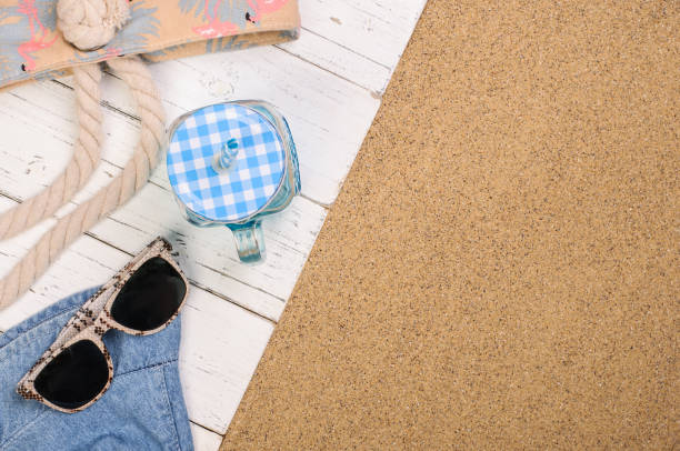 istock summer beach accessories on white wood planks on the sand 1324635242