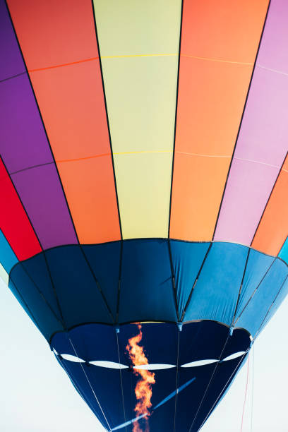 istock Striped hot air balloon in the sky. 1324642029