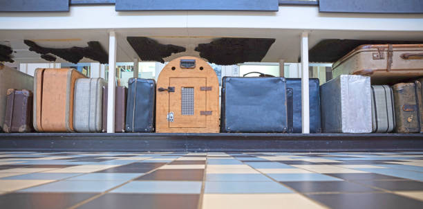 Old luggage and suit cases waiting to be checked in, selective focus