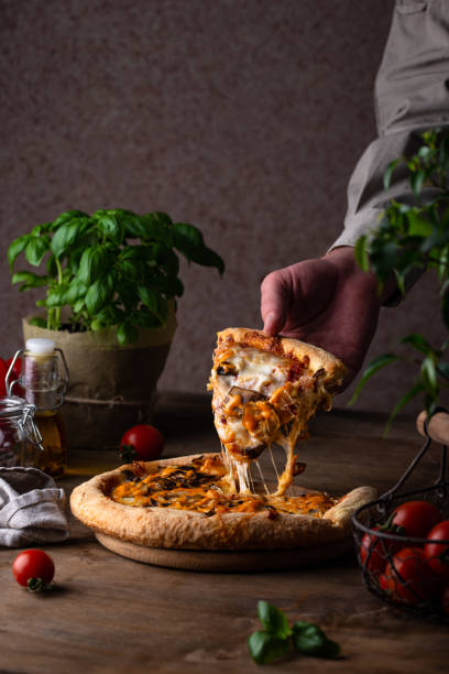 istock Traditional Italian pizza with cheese and mushrooms 1324646542