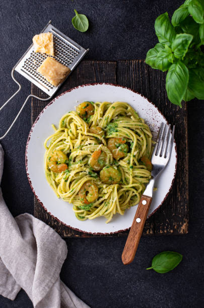 istock Italian pasta with spinach and shrimps 1324646557