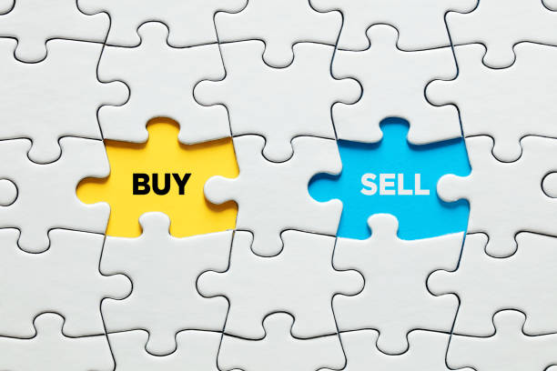 istock Missing puzzle pieces with buy and sell options. Making a choice between buying and selling 1324647214