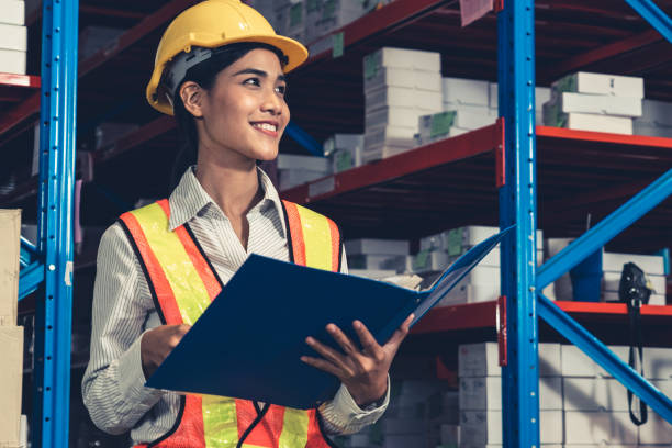 istock Female warehouse worker working at the storehouse 1324650089