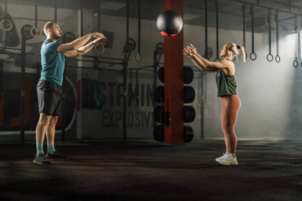 istock gym training with medicine ball in a gym! 1324651519
