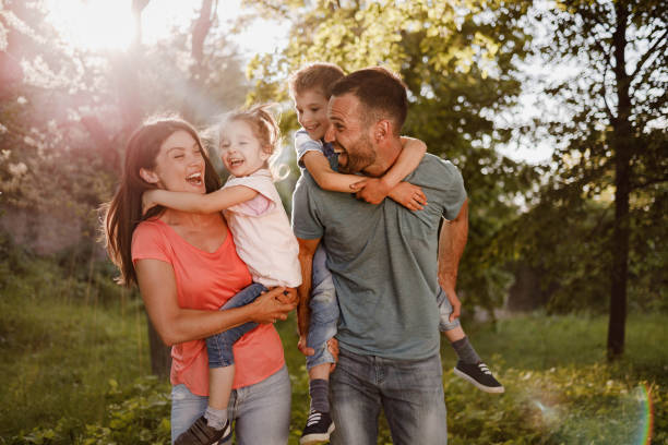 istock Cheerful family having fun during spring day at the park. 1324652863