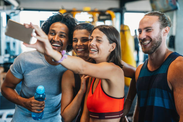 istock Group of young people doing exercises in gym 1324657577