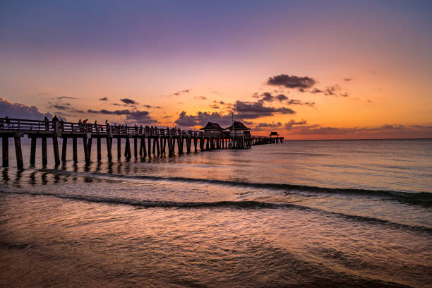 istock pier jetty at sunset in Naples, forida, usa 1324658154