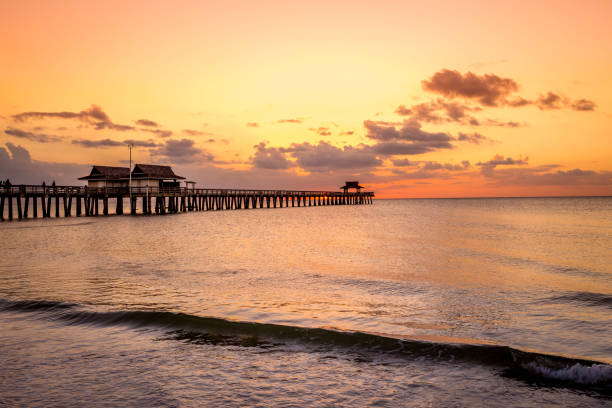 istock pier jetty at sunset in Naples, forida, usa 1324658160