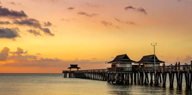 istock pier jetty at sunset in Naples, forida, usa 1324658165