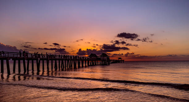istock pier jetty at sunset in Naples, forida, usa 1324658167