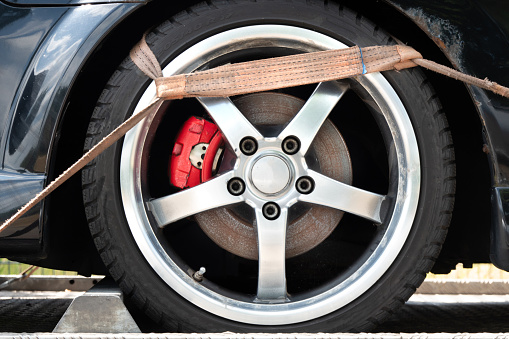 Belt Hook On The Tire Of The Towed Car