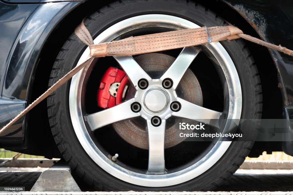 Belt Hook On The Tire Of The Towed Car Tow Truck Stock Photo