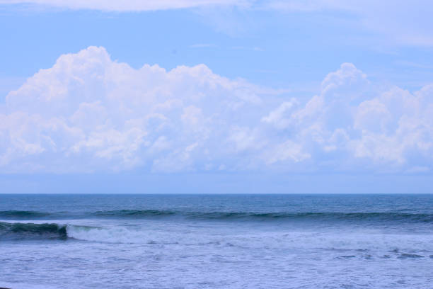 istock Beach scene showing wave, sea and sky 1324663722
