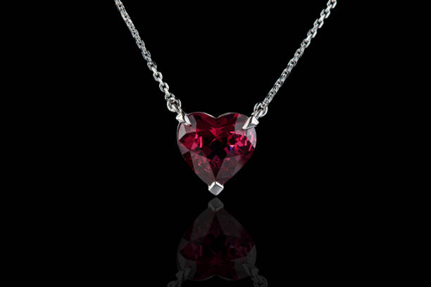 istock beautiful pendant with garnet with a gold chain on a black background 1324663782